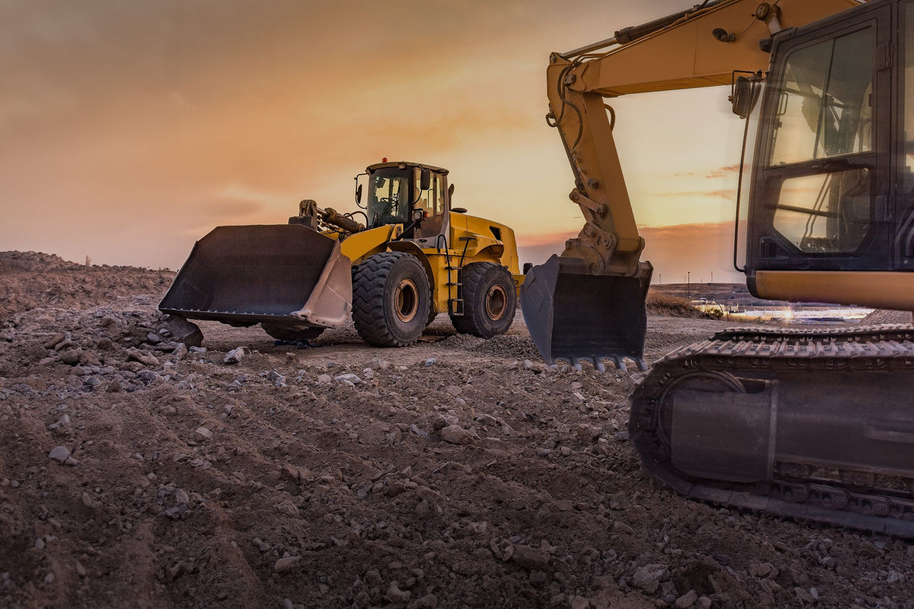Excavator and wheel loader on construction site