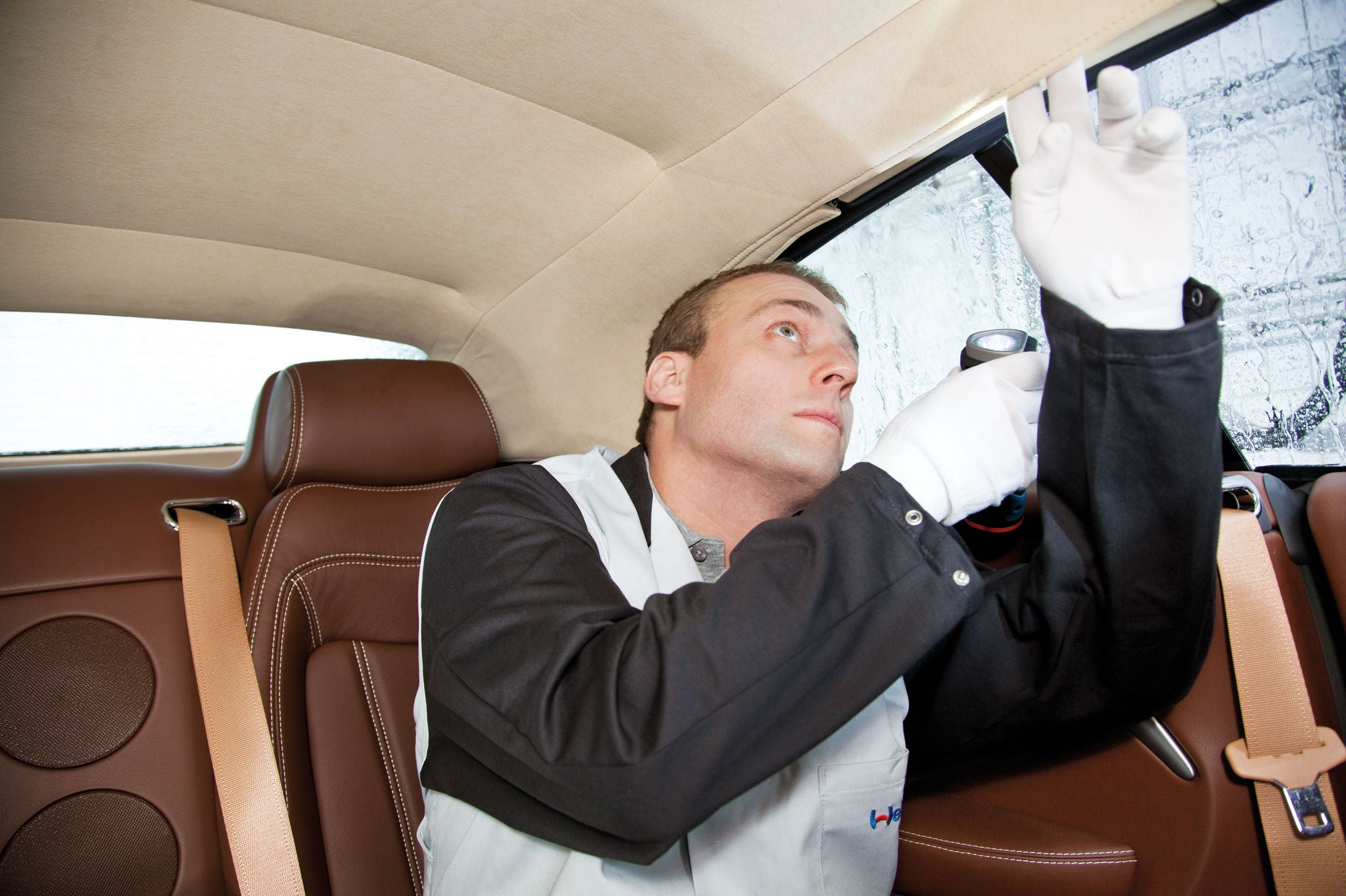 Man Leak test a convertible roof