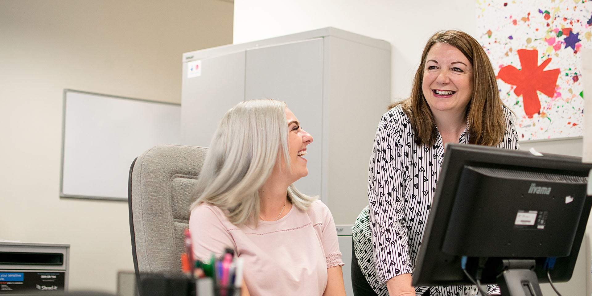 Two friendly, helpful women 