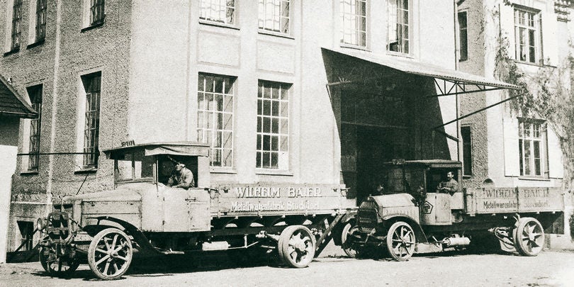 Trucks in front of a factory 